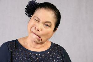 Elderly senior Asian woman posing facial expression photo