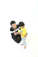 South East Asian young father mother daughter son parent boy girl child activity indoor photo