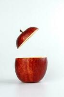 Health Red Cut Apple floating top slice juice drink idea concept on white background photo
