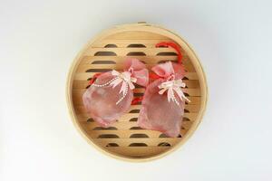 Egg flower or bunga telur a traditional malay wedding gift important part of reception door gift in bamboo steamer photo