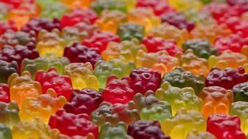 full frame looped spinning background of colorful jelly bear candies video