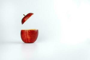 Health Red Cut Apple floating top slice juice drink idea concept on white background photo