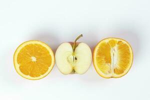 red apple orange fruit slice half on white background photo