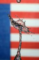 Water droplet drop splash collision dripping pillar Malaysia Flag reflection refraction independence country patriot photo