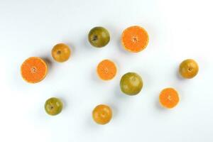 small yellow green mandarin orange whole slice on white background copy space for text photo