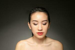 Young beautiful Asian woman facial expression photo