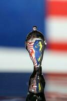 Water droplet drop splash collision dripping pillar Malaysia Flag reflection refraction independence country patriot photo