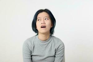 Young attractive Asian chinese malay woman pose face body expression mode emotion on white background wonder thinking photo