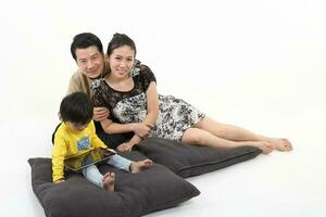 South East Asian young father mother daughter son parent boy girl child activity indoor photo