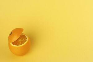 Healthy Orange Cut floating top slice juice drink idea concept on yellow background photo