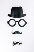 Black hat round eyewear spectacle frame moustache blue neck bow tie face shape paper die cut selfie portrait party fun paper prop sticker stick on white background photo