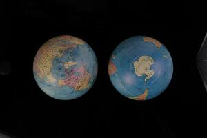 half globe planet world map earth on black background photo