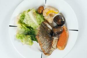 Grilled Seabass vegetable and salad photo