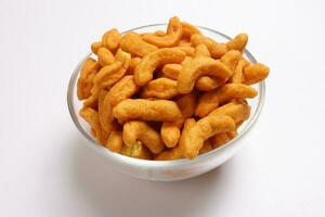 Deep fried battered onion pakoda slightly curly crispy spicy ready to eat snack photo