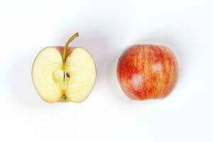 red apple whole half cut slice top view on white background photo