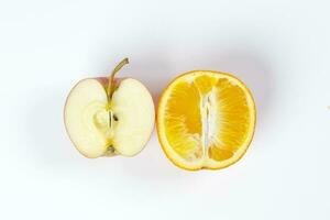 red apple orange fruit slice half on white background photo