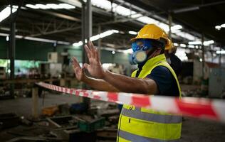 Restricted area, officials employ white and red stripes to block the area where a chemical leak is occurring. To prevent individuals from coming into contact with potentially dangerous chemicals, photo