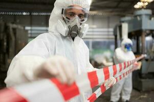 Restricted area, officials employ white and red stripes to block the area where a chemical leak is occurring. To prevent individuals from coming into contact with potentially dangerous chemicals, photo