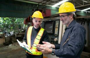 Engineers and technicians check the electrical system and repair the mechanical system in the control cabinet of the machine. in order for the machine to return to normal operation photo