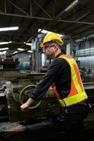 Mechanical engineers enter the old machinery warehouse to inspect and repair used machinery with the warehouse's personnel. photo