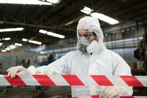 Restricted area, officials employ white and red stripes to block the area where a chemical leak is occurring. To prevent individuals from coming into contact with potentially dangerous chemicals, photo