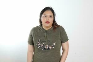 Young plus size south east asian woman pose face expression emotion on white background photo