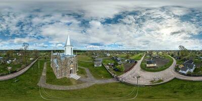 full hdri 360 panorama aerial view of neo gothic catholic church in countryside in equirectangular projection with zenith and nadir. VR  AR content photo