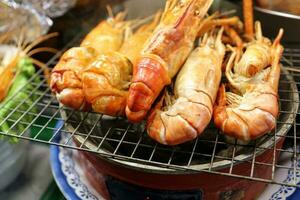 Fresh prawn shrimp BBQ grill at street side food stall photo