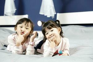 Two girl children looking forward posing photo