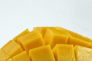 ripe yellow mango cut slice whole on white background photo