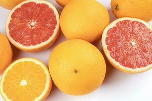 Orange grapefruit slice closeup on white background photo