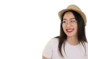 Beautiful young south east Asian woman wearing eyewear golden frame glasses hat pose fashion style white background look around copy text space photo