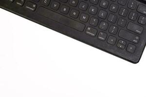 Black computer keyboard on white background top view copy text space photo