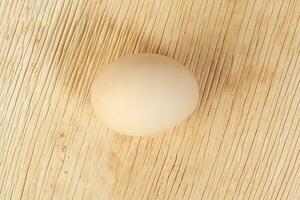 Eggs in a nest basket on white background photo