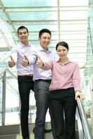 Young south east Asian middle eastern man woman business colleague outdoor stand pose photo