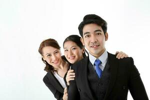 Southeast Asian young office business man woman wearing suit stand one behind other expressions happy success smile on white studio background photo