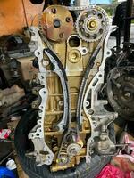 Car engine motor timing chain belt cover open for repair photo