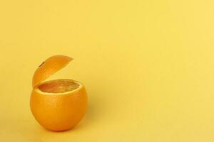 Healthy Orange Cut floating top slice juice drink idea concept on yellow background photo
