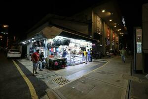 KUALA LUMPUR, MALAYSIA- MARCH 28, 2018 Jalan Bukit Bintang is a hub for after-dark entertainment, hosting unique themed nights, games and live bands. Late night shoppers paradise. photo