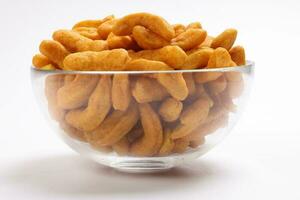 Deep fried battered onion pakoda slightly curly crispy spicy ready to eat snack photo