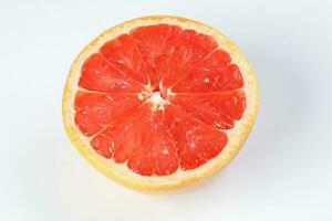 Ruby red grapefruit cut closeup photo