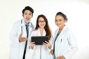 oung asian chinese malay male female doctor on white background holding pad tab happy look at camera photo