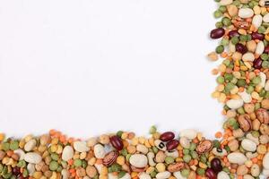 Mixed beans multi grain colorful mixture frame border copy text space on white background photo