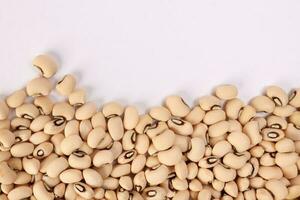 Blackeye beans horizontal line frame border copy text space on white background photo