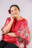 Elderly senior Asian woman posing facial expression photo