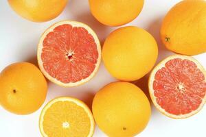 Orange grapefruit slice closeup on white background photo