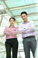 Young south east Asian middle eastern man woman business colleague outdoor stand pose photo