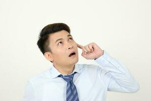 South east Asian chinese Man facial expression thinking finger on forehead photo