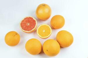 Orange grapefruit slice closeup on white background photo