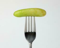 Small mini fresh green cucumber photo